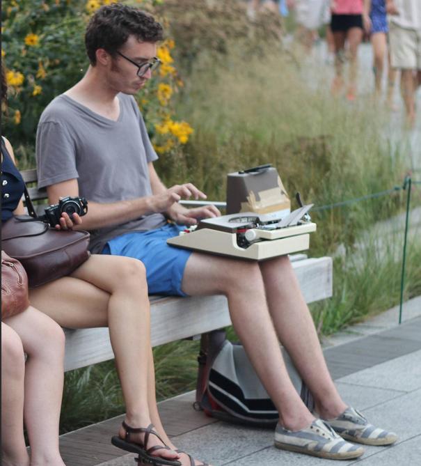 the photo of the typewriter busker who got hated on for being a hipster