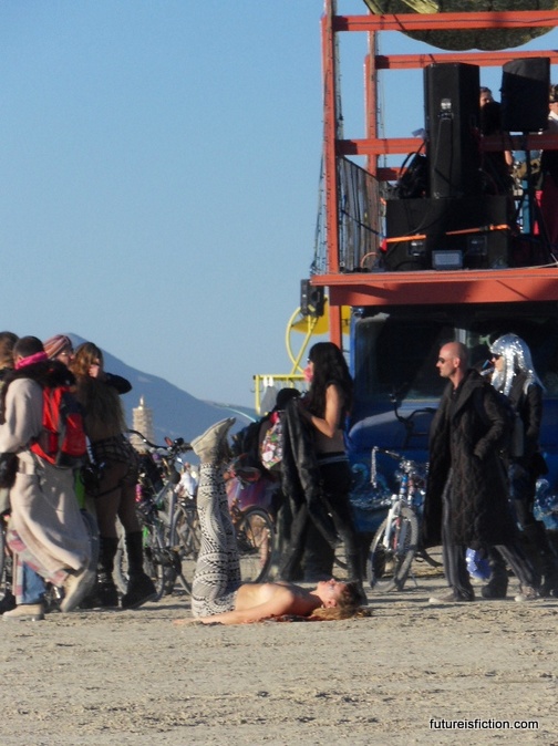 girl doing yoga at Burning Man