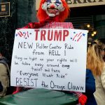 Clown puppet with sign: "TRUMP: New roller coaster ride from HELL! Hang on tight as your rights are stripped away at every twist and turn. Everyone must ride!"