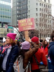 Protest sign at Women's March in Oakland: Womyn live longer than fascists