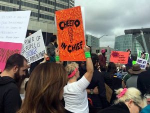 protest sign covered in actual cheetos.