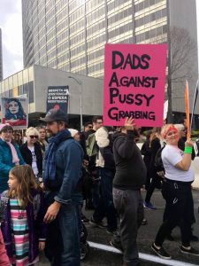 protest sign: Dads Against Pussy Grabbers