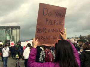 Protest sign at Oakland Women's March: Do you prefer UN-planned parenthood?