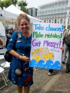 A Magic Schoolbus protest sign: "Take chances! Make mistakes! Get messy" -Ms. Frizzle