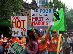 Climate change protest signs: Too hot to handle, the poor will be hit first and hardest